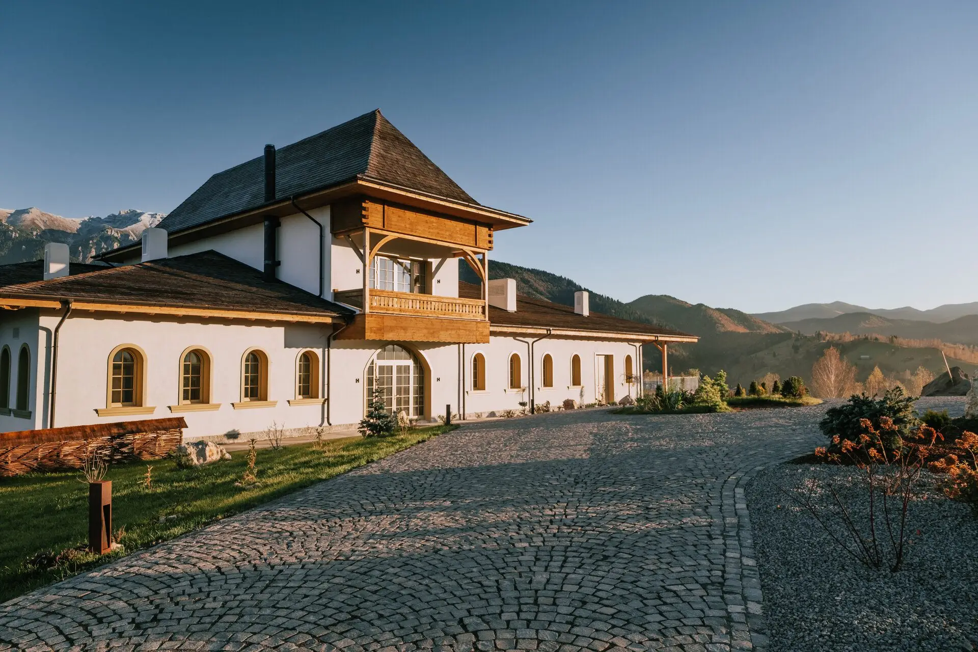 MATCA Transylvanian Sanctuary boutique hotel at sunset, Romania, with Carpathian mountains - HOTELkonzept boutique hotel consultancy project